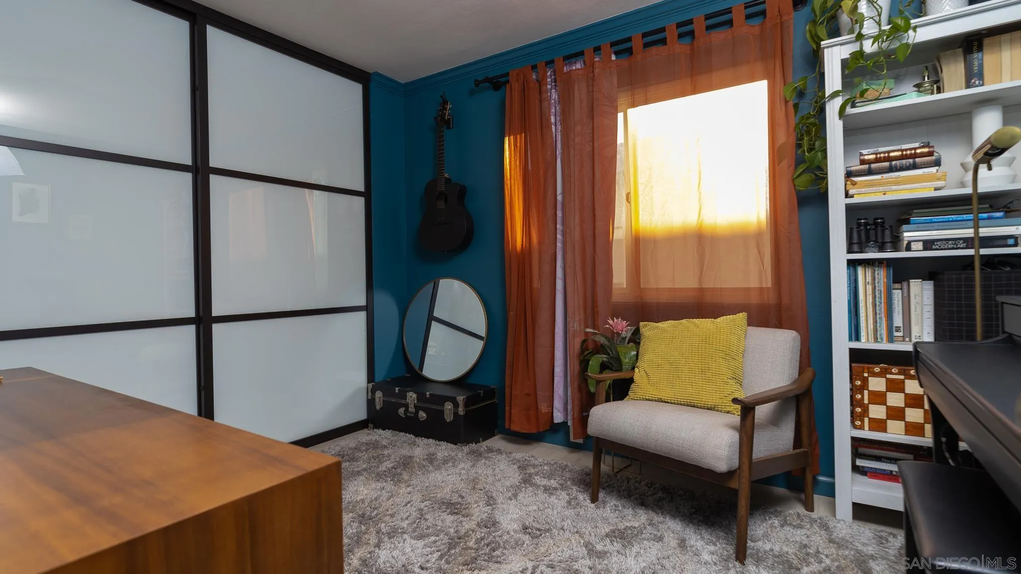 6358 Rancho Mission Road, Unit 624 San Diego, CA 92108 - Photo 12 of 23 a living room with furniture cabinets and a window