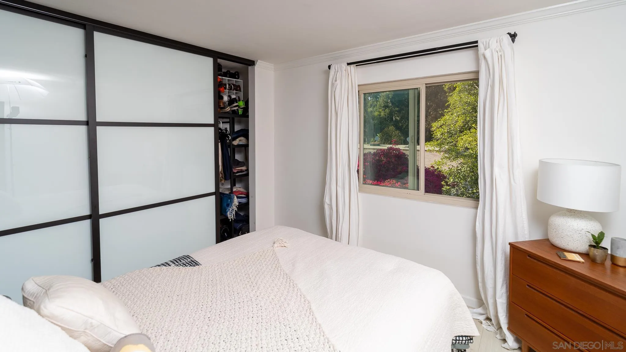 6358 Rancho Mission Road, Unit 624 San Diego, CA 92108 - Photo 14 of 23 a bedroom with a bed and a window