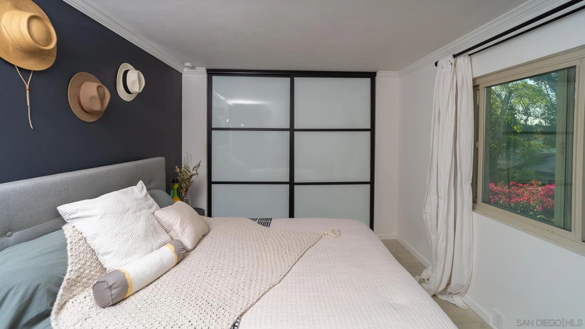 6358 Rancho Mission Road, Unit 624 San Diego, CA 92108 - Photo 15 of 23 a bedroom with a bed and a window