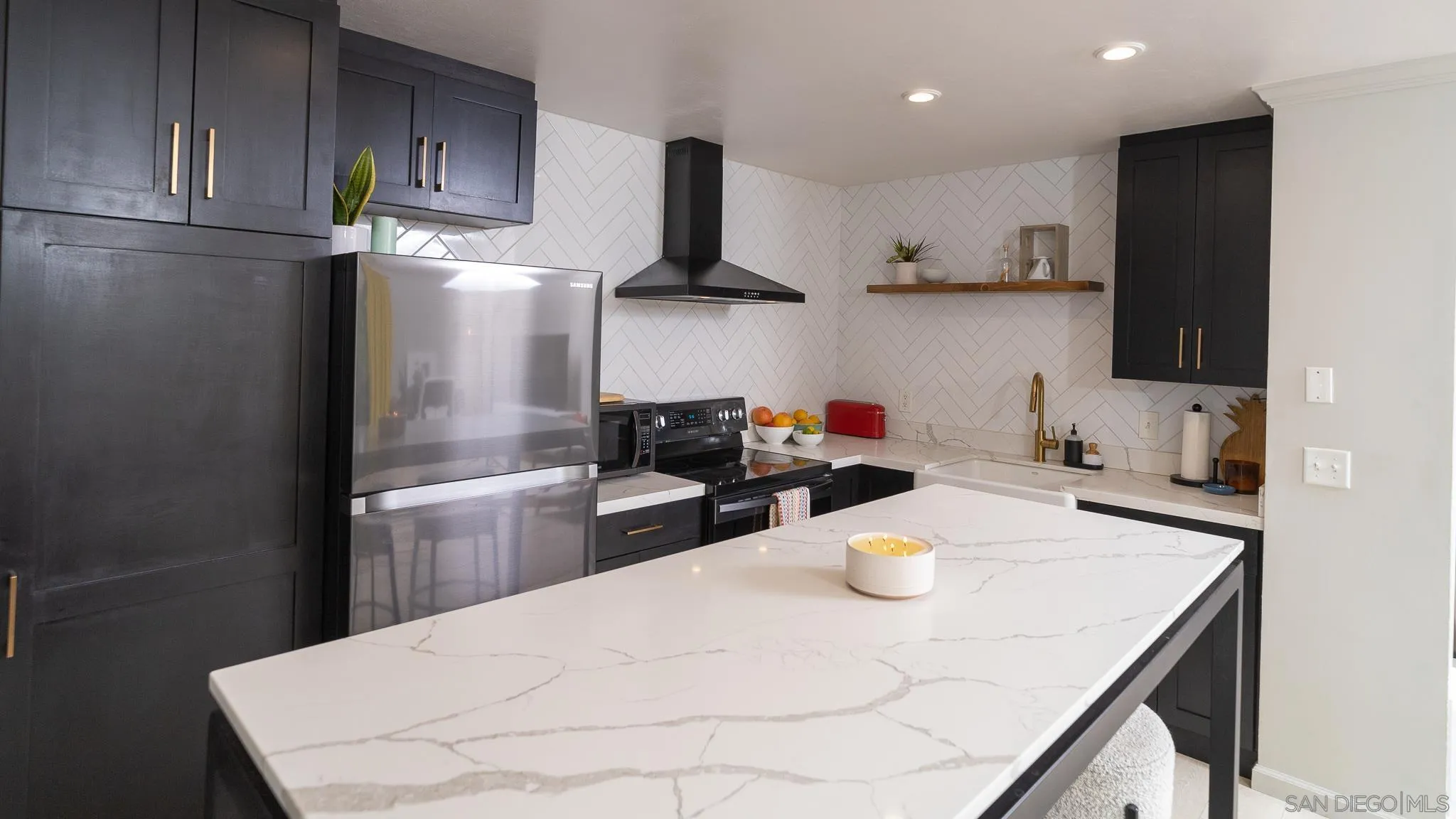6358 Rancho Mission Road, Unit 624 San Diego, CA 92108 - Photo 3 of 23 a kitchen with stainless steel appliances a sink a stove a refrigerator and cabinets