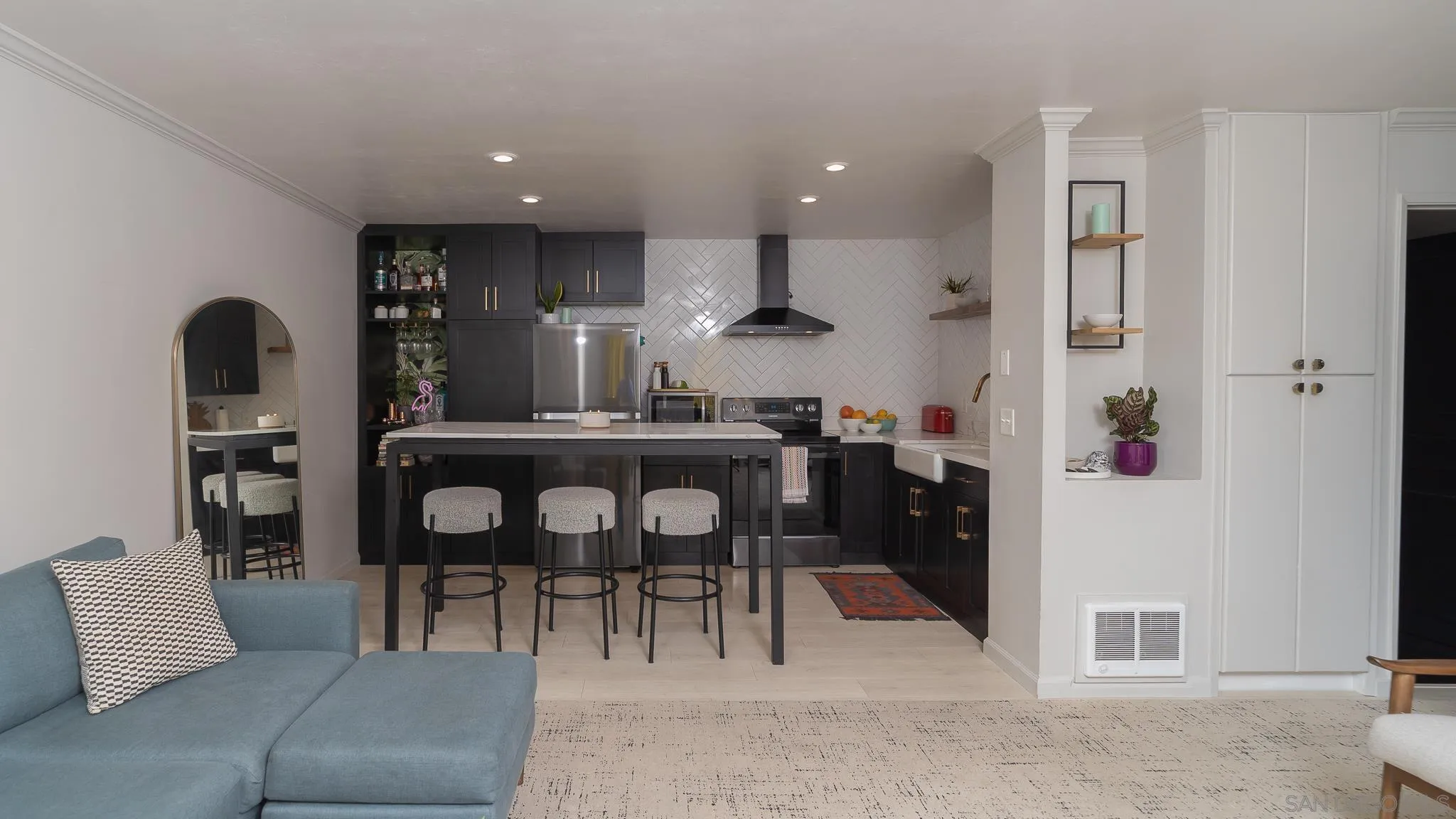 6358 Rancho Mission Road, Unit 624 San Diego, CA 92108 - Photo 5 of 23 a living room with furniture and a dining table with kitchen view