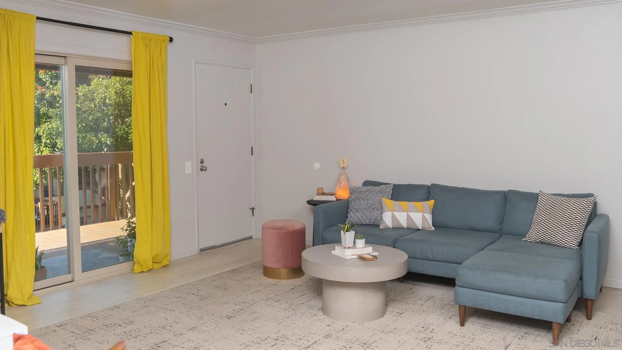 6358 Rancho Mission Road, Unit 624 San Diego, CA 92108 - Photo 6 of 23 a living room with furniture and a table