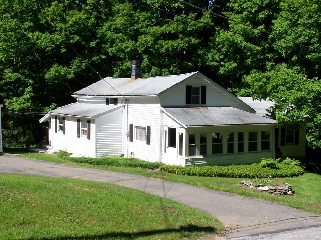 23 Blue Swamp Road Litchfield, CT 06759 - Photo 1 of 1 a front view of a house with a yard