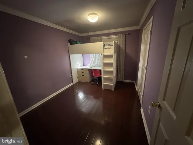 wooden floor in a hall with a window