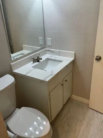 a bathroom with a sink and a toilet