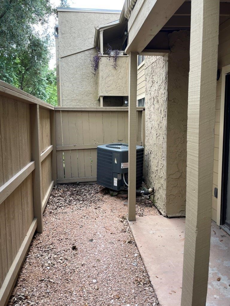 3608 Ocee Street Houston, TX 77063 - Photo 19 of 19 a room with a large tree and wooden fence