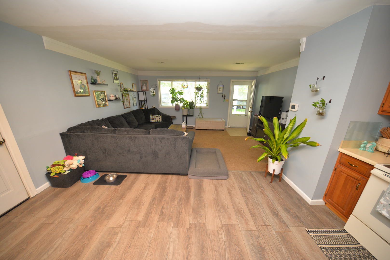 8 East Crownview Mount Vernon, IL 62864 - Photo 12 of 27 a living room with furniture flowerpot and wooden floor
