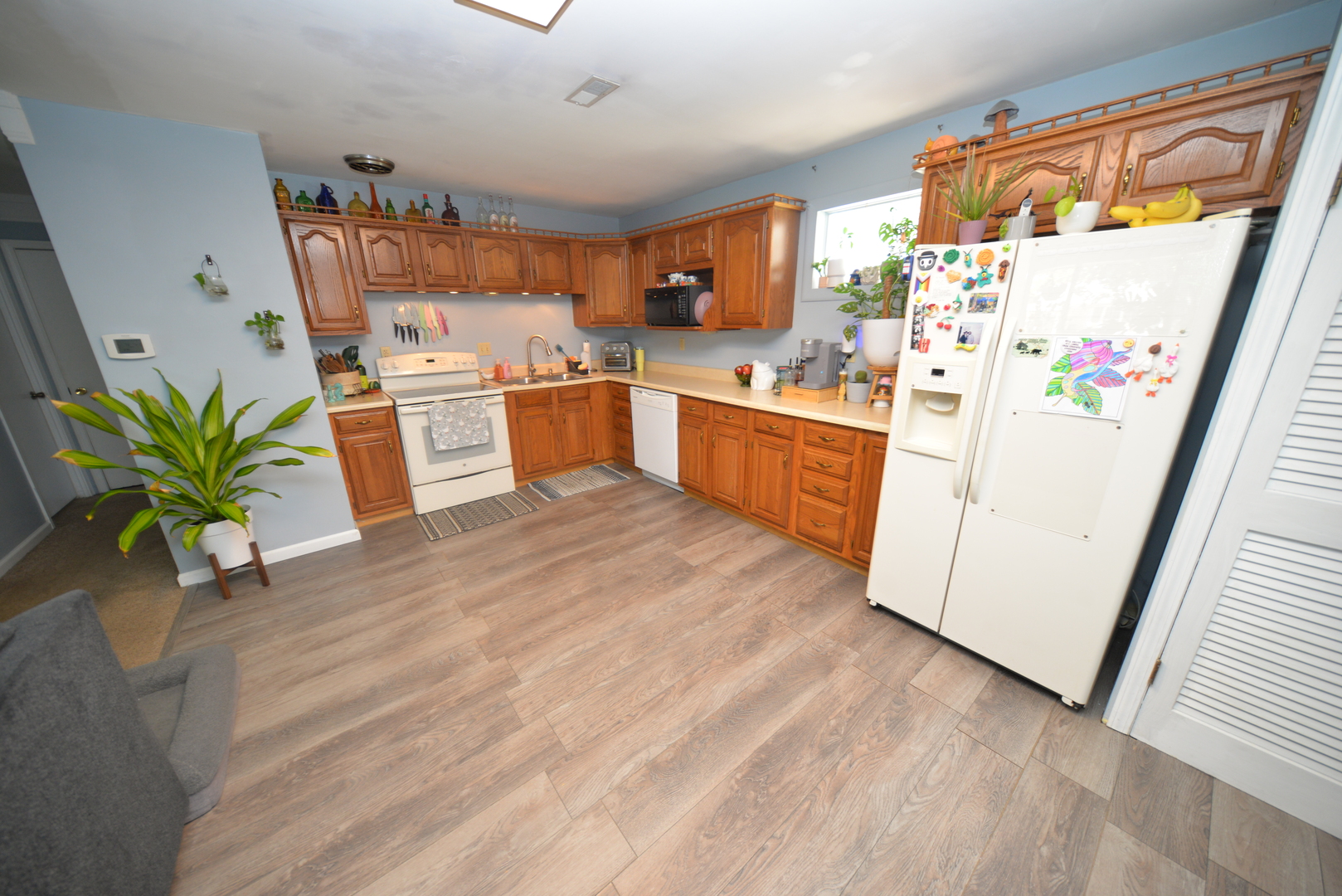 8 East Crownview Mount Vernon, IL 62864 - Photo 13 of 27 a kitchen with stainless steel appliances a refrigerator a sink a stove and white cabinets