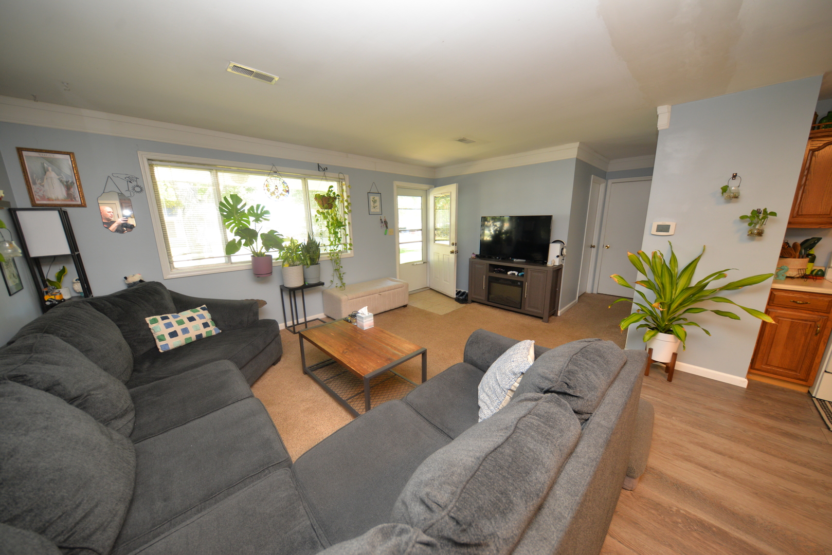 8 East Crownview Mount Vernon, IL 62864 - Photo 16 of 27 a living room with furniture flat screen tv and a large window