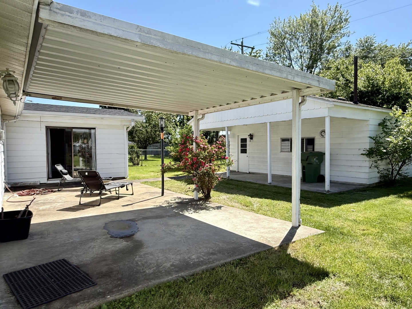 8 East Crownview Mount Vernon, IL 62864 - Photo 5 of 27 a view of a patio with table and chairs potted plants and a palm tree