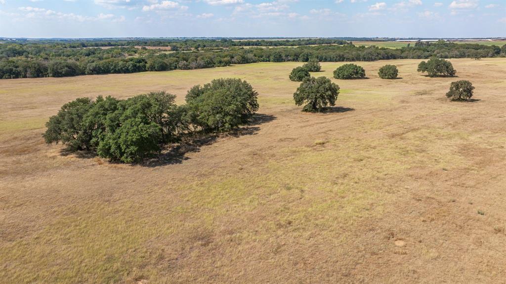 3066 County Road 285 Dublin, TX 76446 - Photo 20 of 40 a view of a lake with mountain in the background