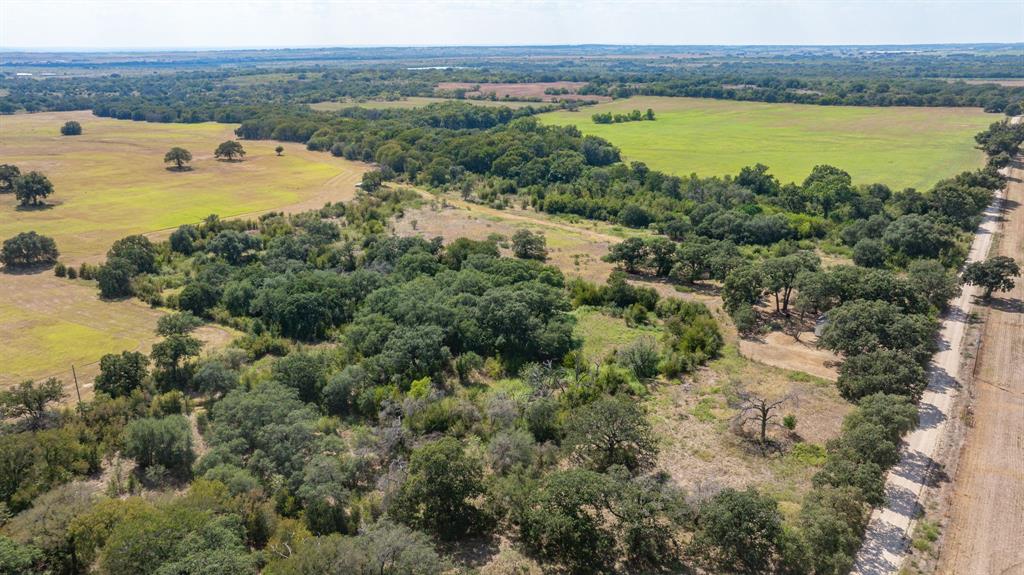 3066 County Road 285 Dublin, TX 76446 - Photo 32 of 40 a view of a lake with houses in the back