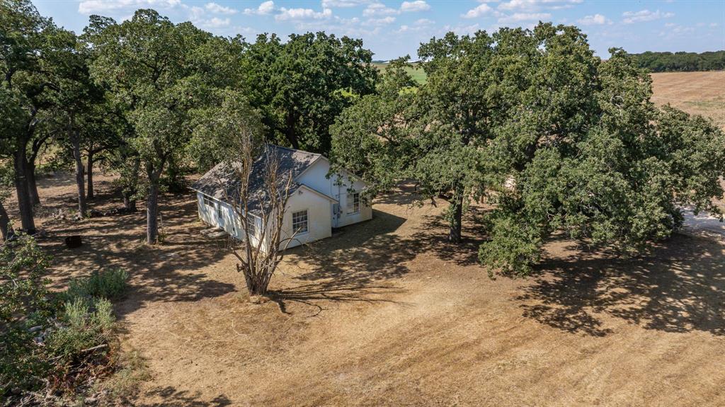 3066 County Road 285 Dublin, TX 76446 - Photo 34 of 40 a view of a house with a yard