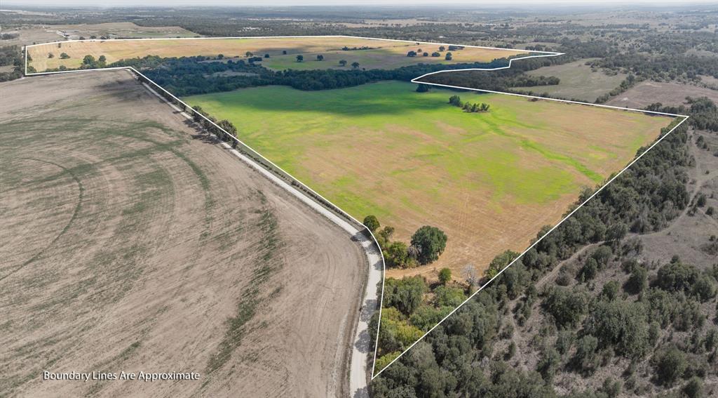 3066 County Road 285 Dublin, TX 76446 - Photo 38 of 40 an aerial view of a house with a yard and lake view