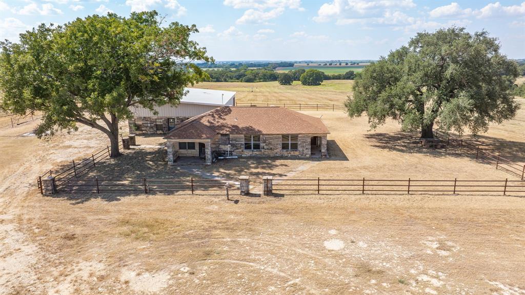 3066 County Road 285 Dublin, TX 76446 - Photo 6 of 40 a view of house with outdoor space and lake view