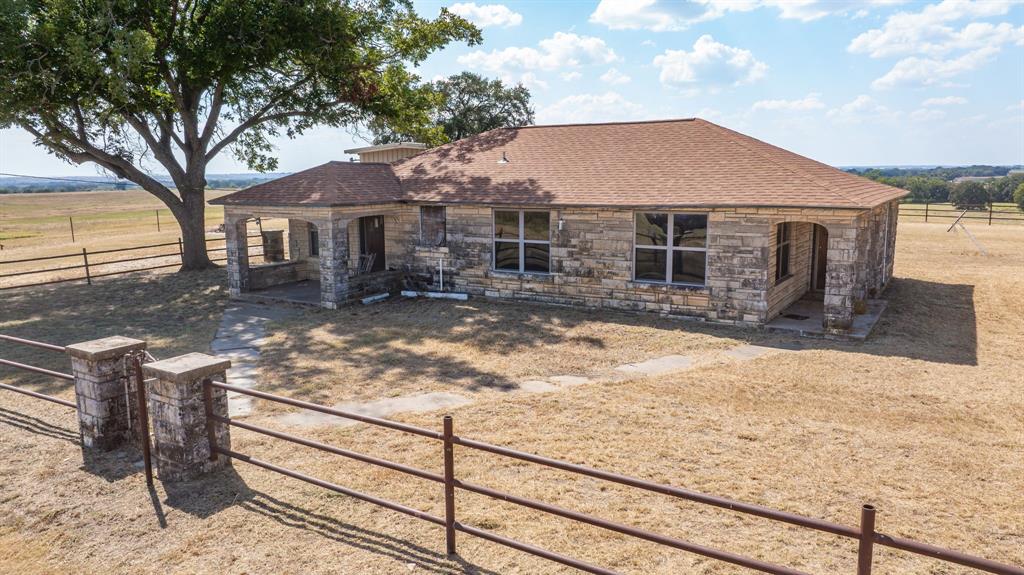 3066 County Road 285 Dublin, TX 76446 - Photo 7 of 40 a front view of a house with yard covered in snow