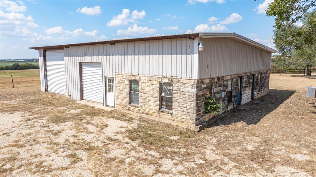 3066 County Road 285 Dublin, TX 76446 - Photo 9 of 40 a view of a house with wooden fence