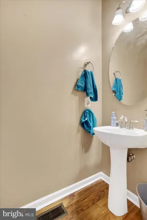 a bathroom with a sink mirror and vanity