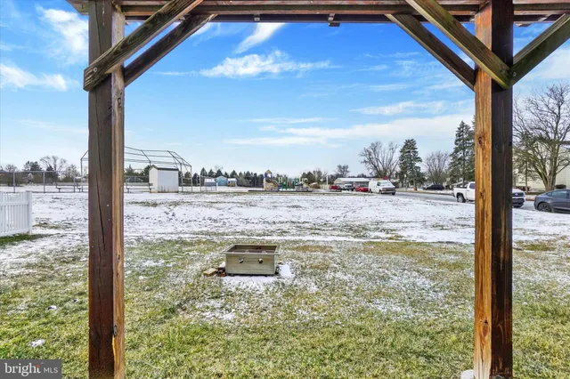 a view of a swimming pool with an outdoor seating