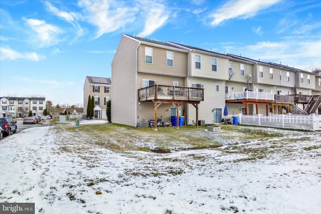 a view of a chair and table on the roof deck