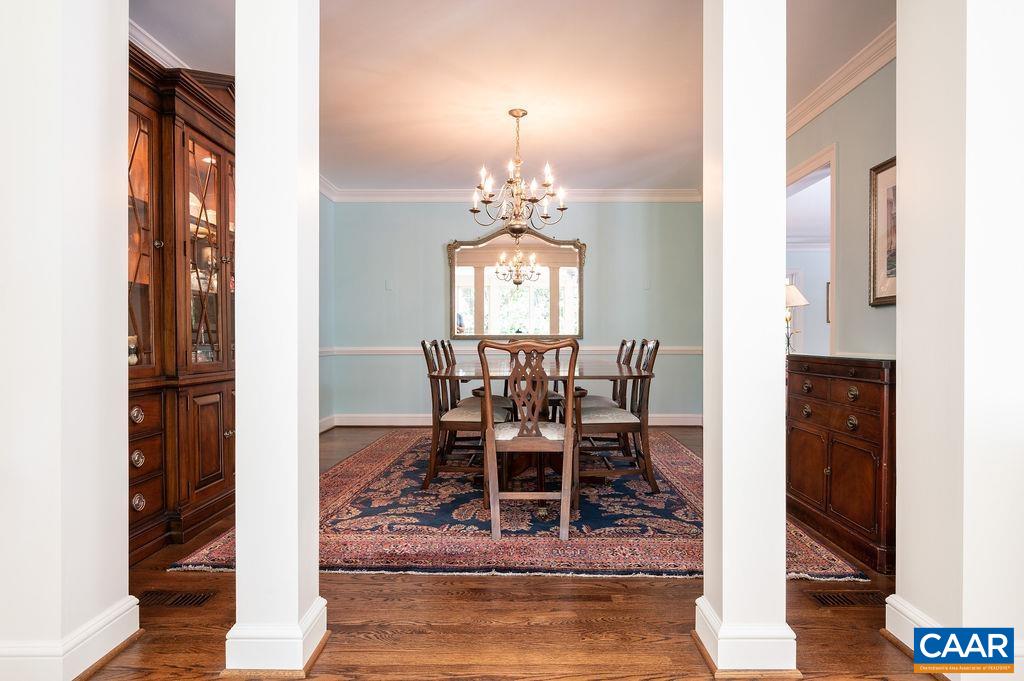 969 Tanglewood Road Charlottesville, VA 22901 - Photo 20 of 62 a dining room with wooden floor a chandelier