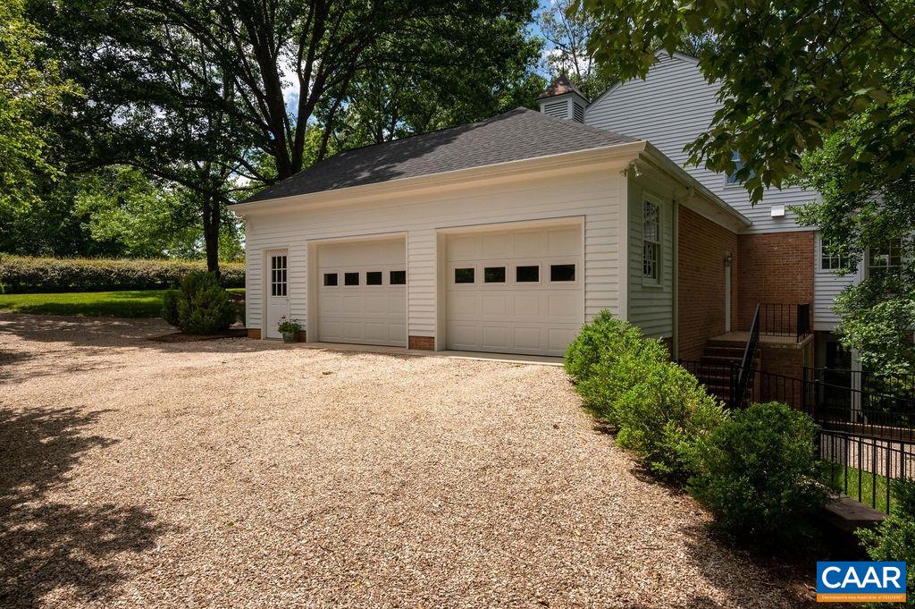 969 Tanglewood Road Charlottesville, VA 22901 - Photo 54 of 62 a front view of a house with a yard and garage
