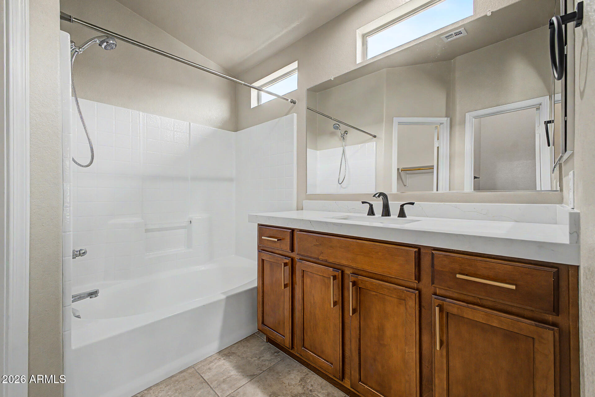 2725 East Mine Creek Road, Unit 2172 Phoenix, AZ 85024 - Photo 19 of 28 a bathroom with a tub sink and mirror