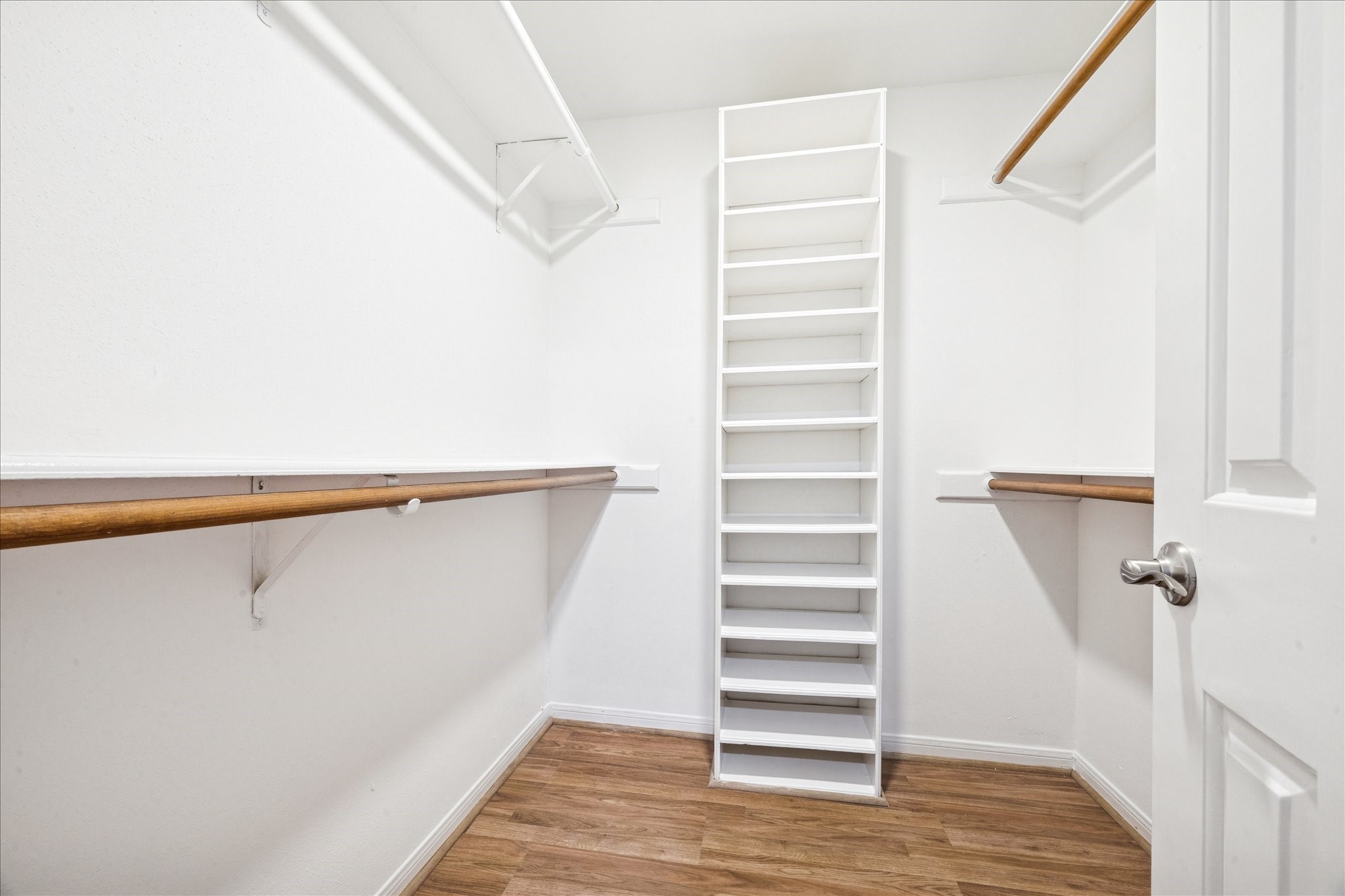 5210 Weslayan Street, Unit 303 Houston, TX 77005 - Photo 12 of 16 a view of walk in closet with empty racks