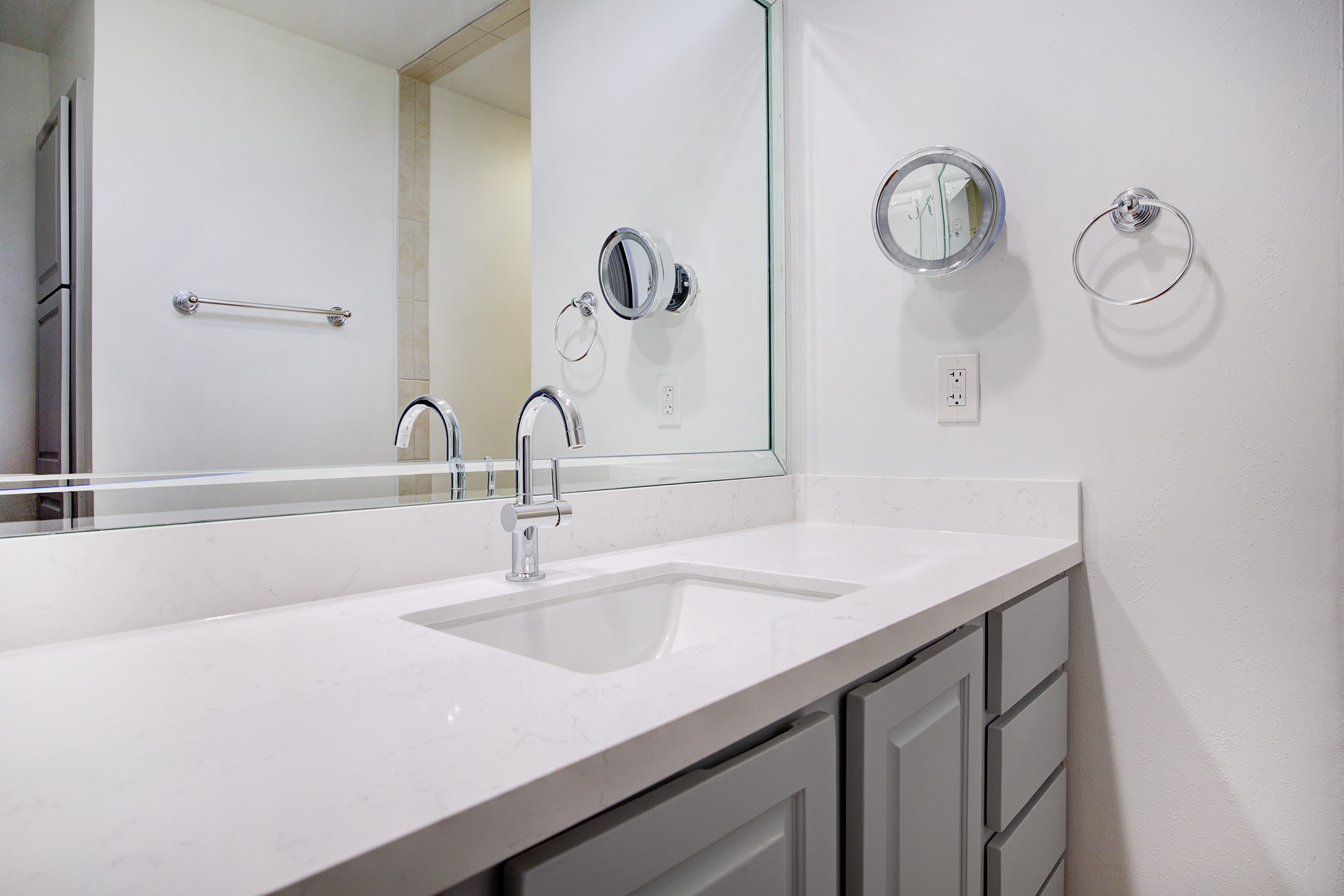 5210 Weslayan Street, Unit 303 Houston, TX 77005 - Photo 14 of 16 a bathroom with a sink and a mirror