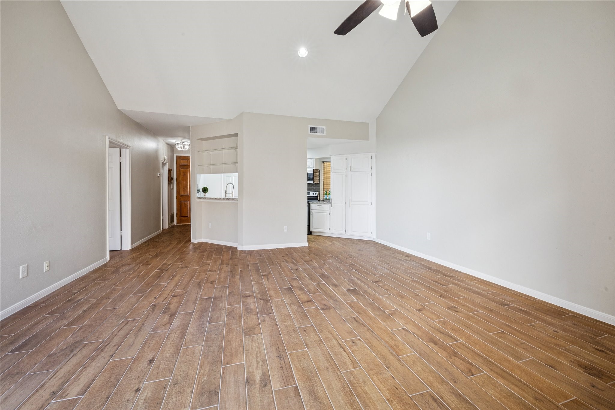 5210 Weslayan Street, Unit 303 Houston, TX 77005 - Photo 5 of 16 a view of empty room with wooden floor