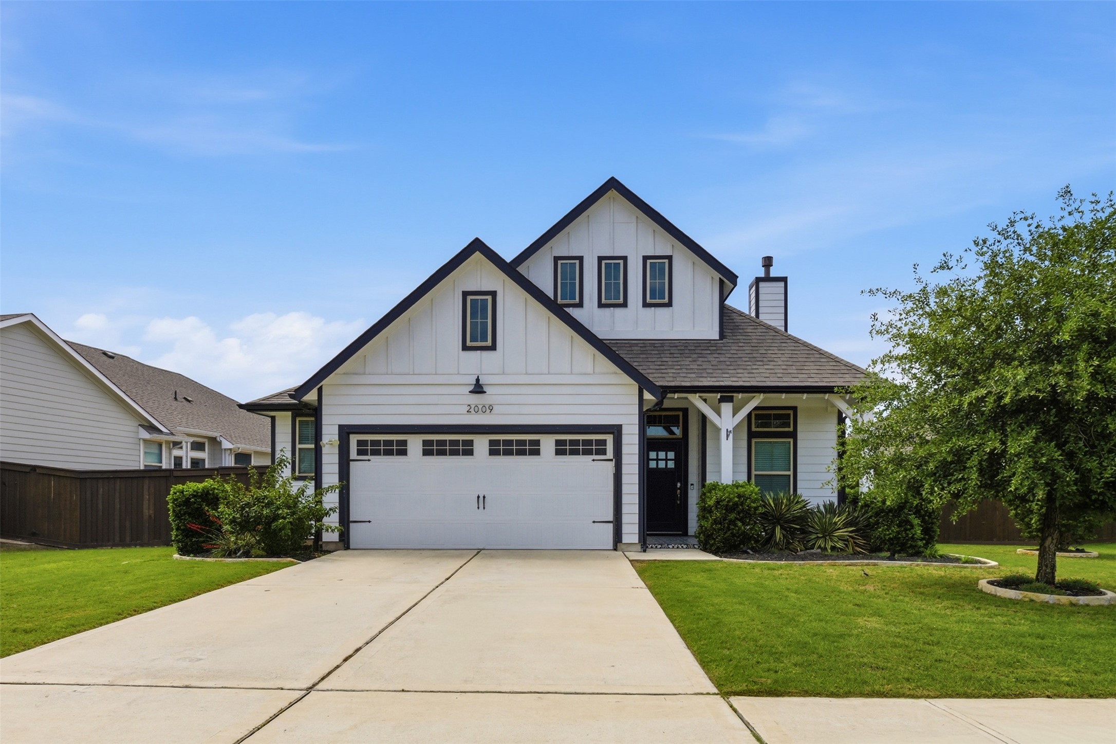 a front view of a house with yard