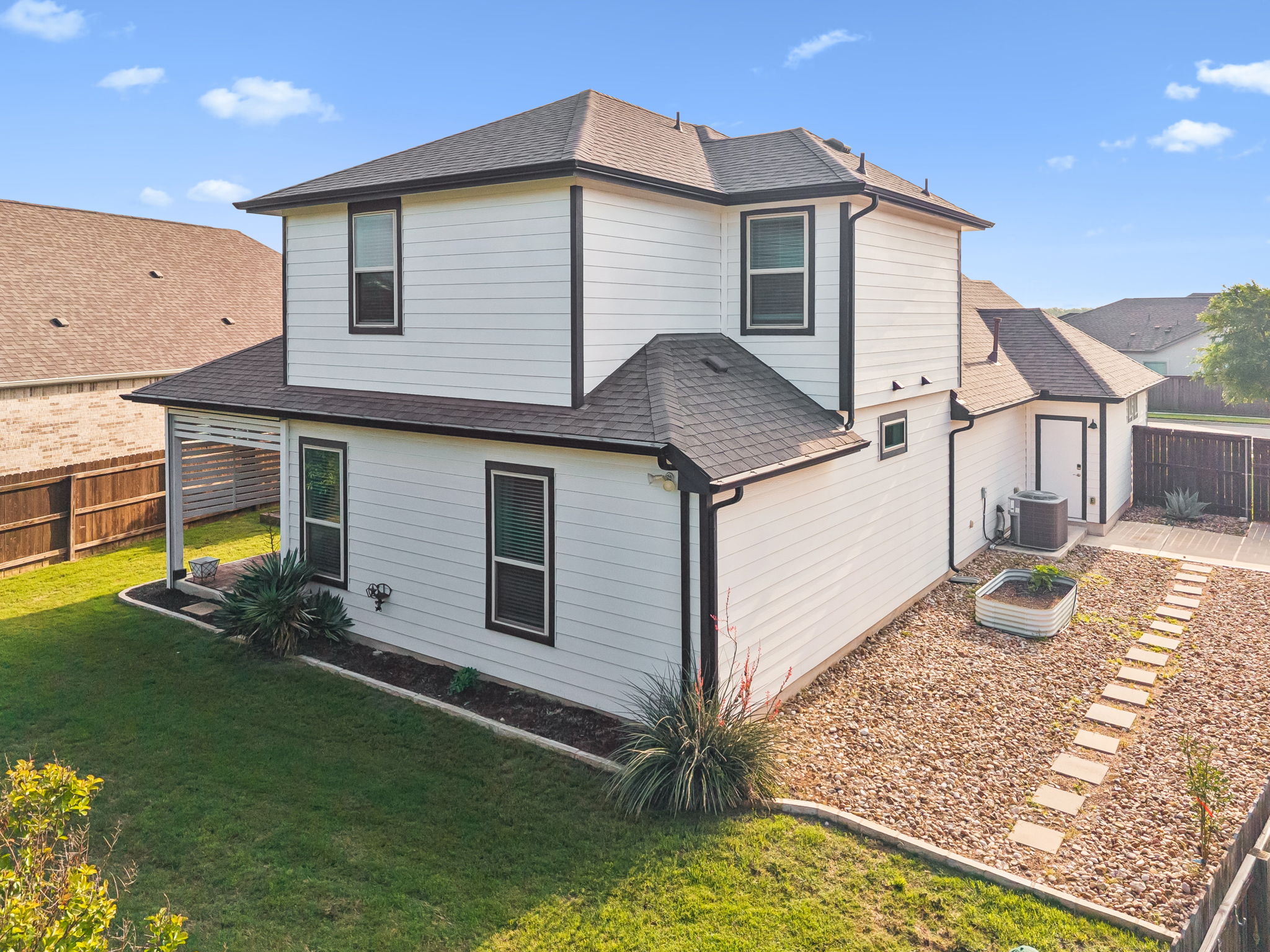 2009 Running Brushy Bend Leander, TX 78641 - Photo 2 of 32 a front view of a house with a yard