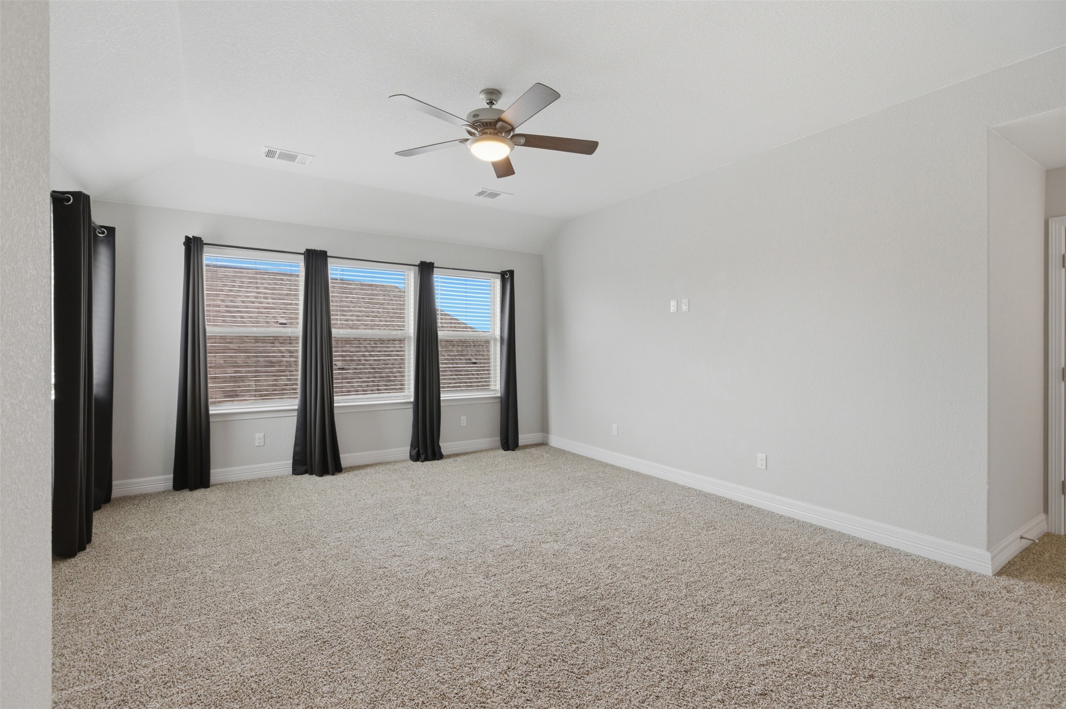 2009 Running Brushy Bend Leander, TX 78641 - Photo 21 of 32 a view of an empty room with chandelier fan and fire place