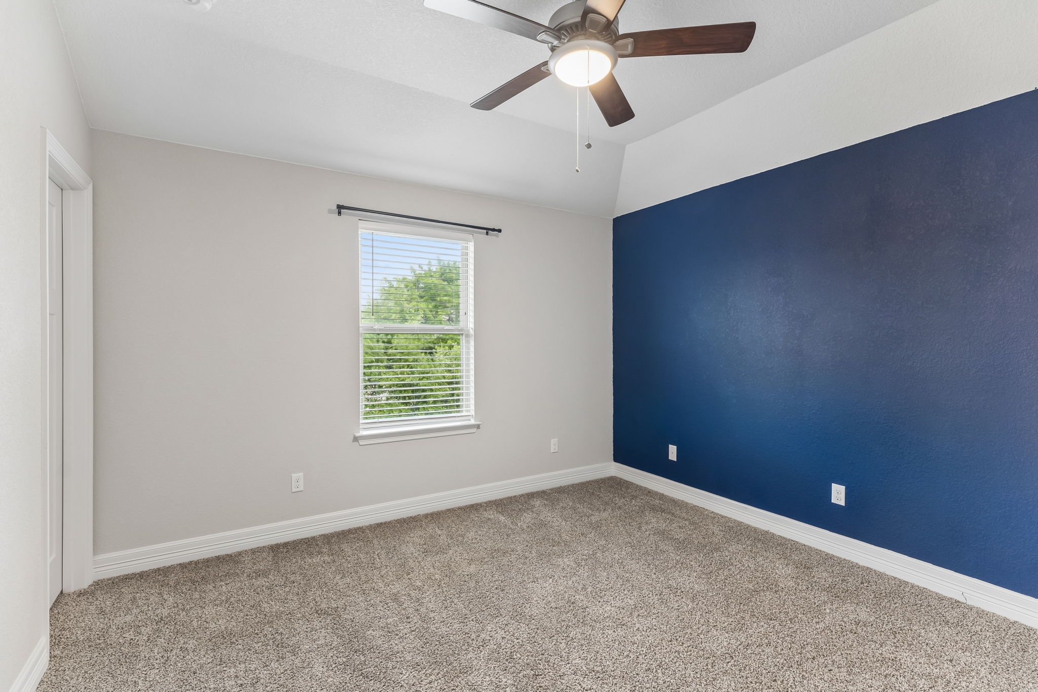 2009 Running Brushy Bend Leander, TX 78641 - Photo 25 of 32 an empty room with a window and a fan