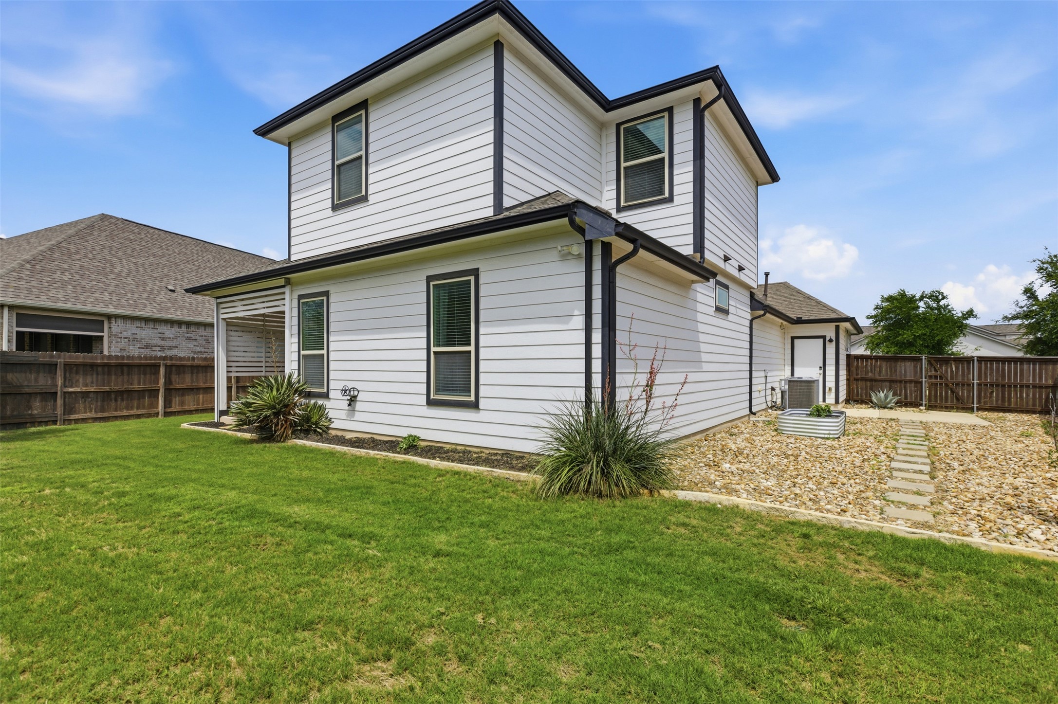 2009 Running Brushy Bend Leander, TX 78641 - Photo 29 of 32 a front view of a house with a yard