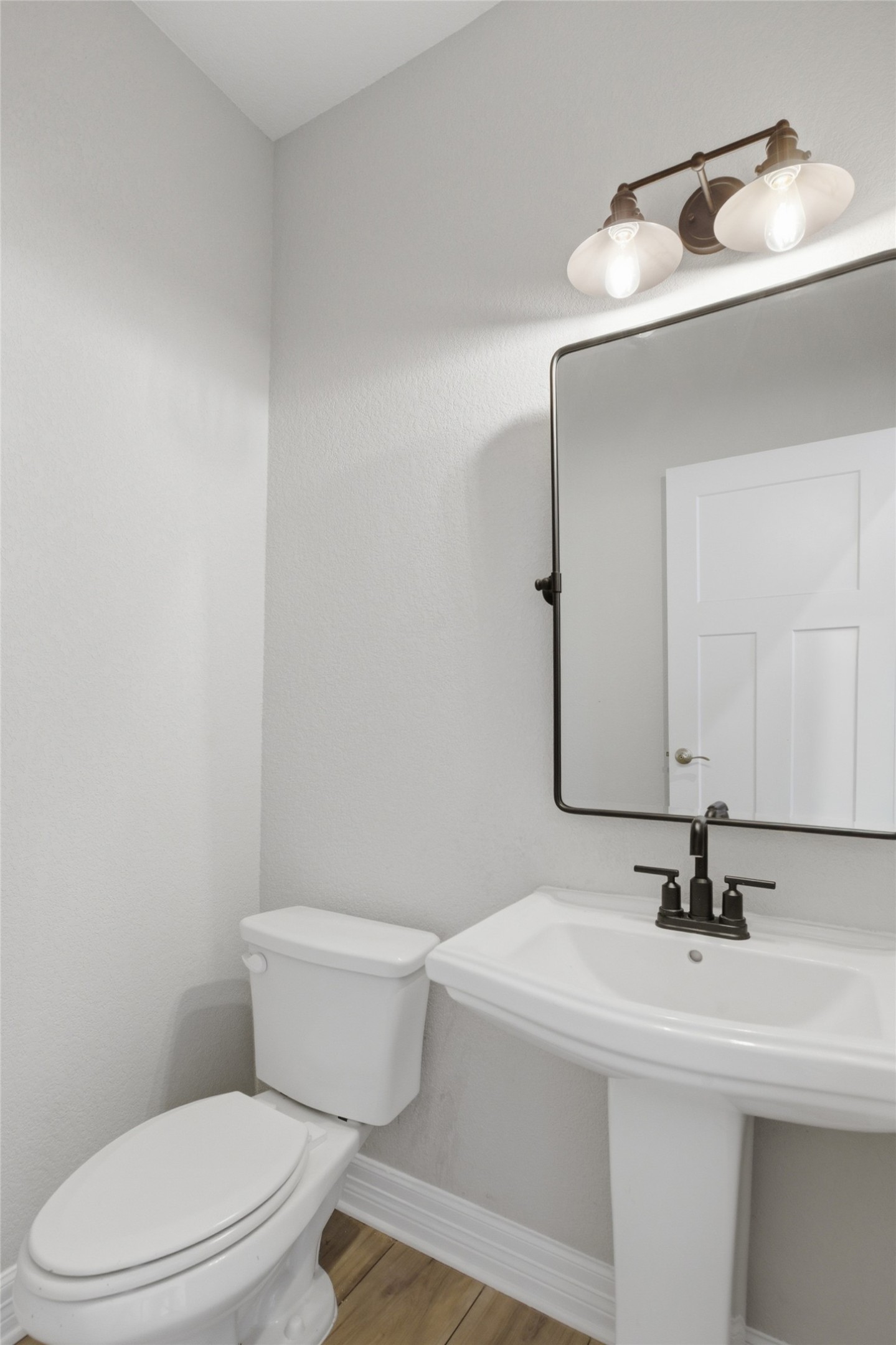 2009 Running Brushy Bend Leander, TX 78641 - Photo 9 of 32 a bathroom with a sink a toilet and mirror