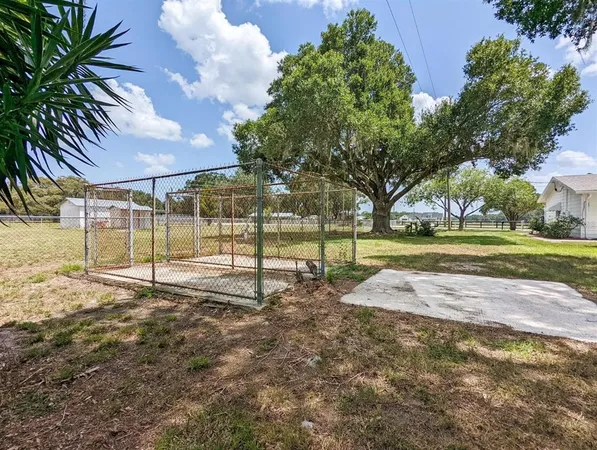 a view of a playground with basketball court