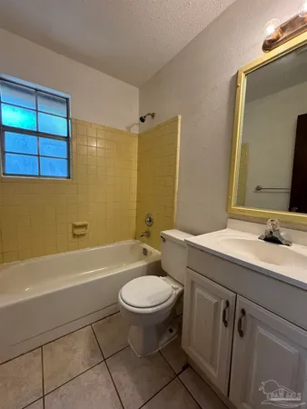 a bathroom with a sink a toilet and a bathtub