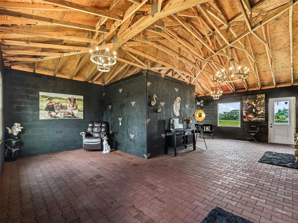 7161 Northeast 22nd Ct Road Ocala, FL 34479 - Photo 12 of 81 a view of a chairs and tables in patio