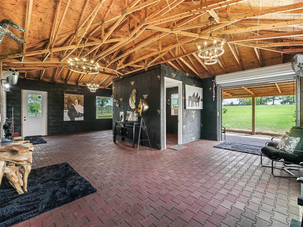 7161 Northeast 22nd Ct Road Ocala, FL 34479 - Photo 16 of 81 a view of an chairs and table in the patio