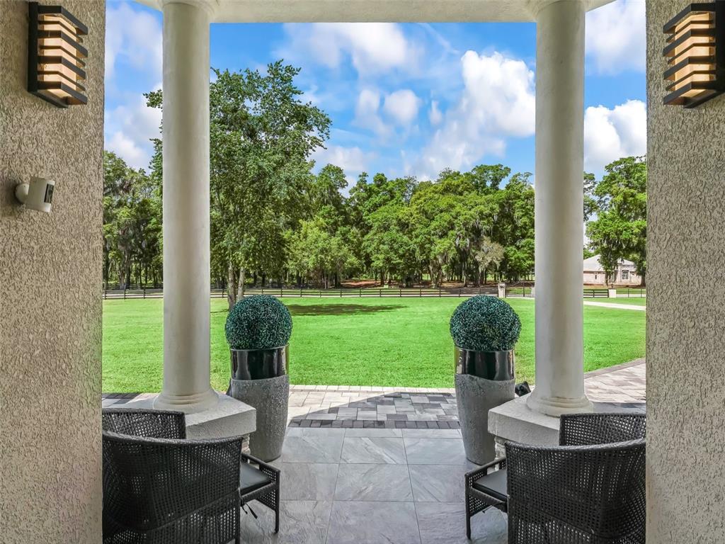 7161 Northeast 22nd Ct Road Ocala, FL 34479 - Photo 21 of 81 a view of a yard with a table and chairs