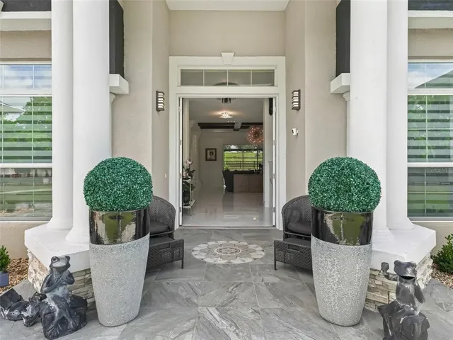 a large kitchen with stainless steel appliances a stove sink and cabinets