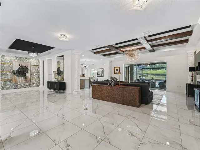a kitchen with stainless steel appliances white cabinets and a refrigerator