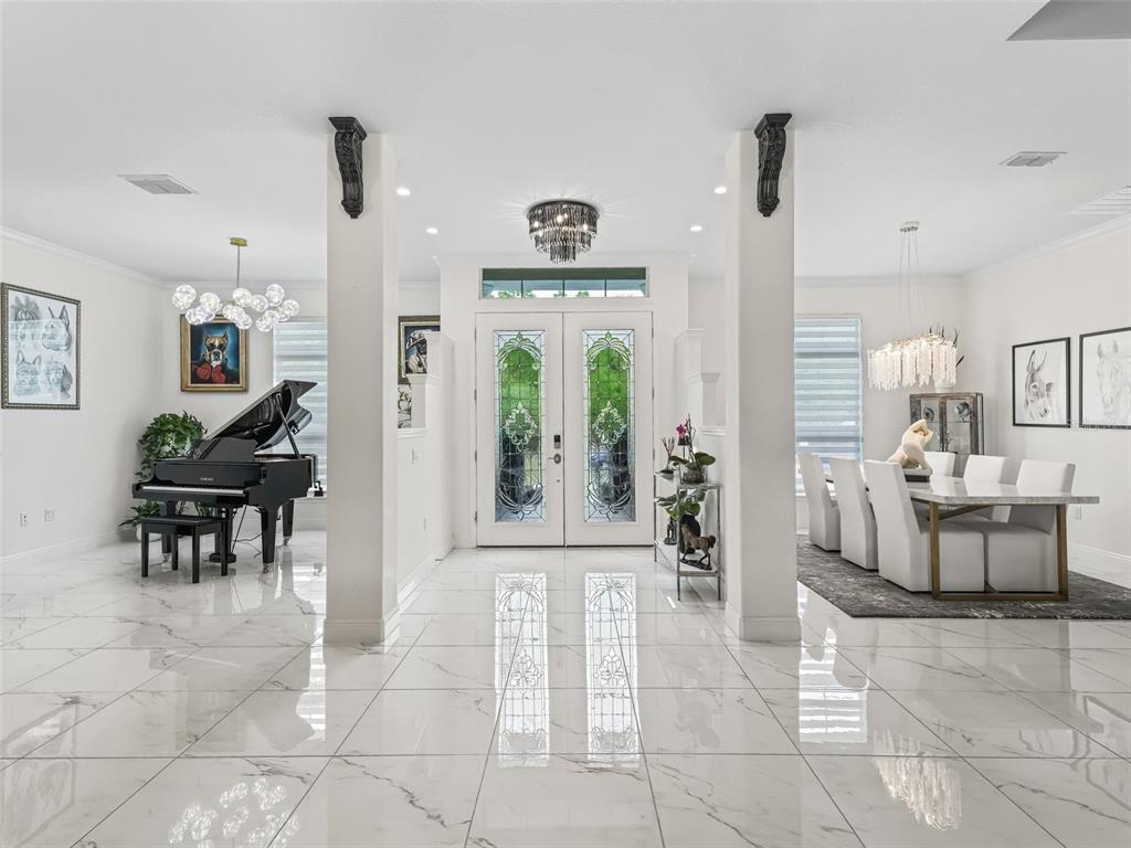 7161 Northeast 22nd Ct Road Ocala, FL 34479 - Photo 25 of 81 a view of a entryway door and dining room