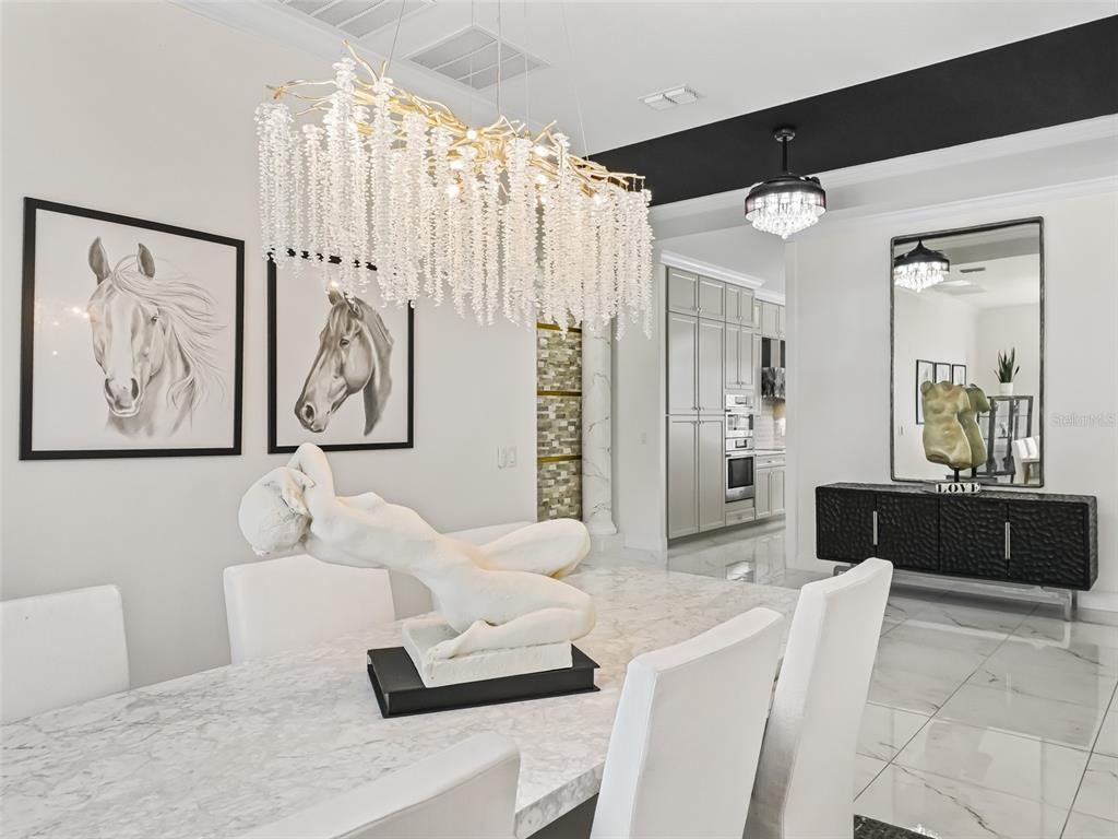 7161 Northeast 22nd Ct Road Ocala, FL 34479 - Photo 31 of 81 a living room with furniture and a chandelier