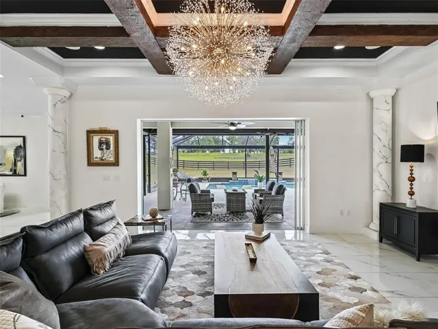 a dining room with furniture a garden and patio