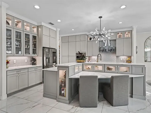 a aerial view of a house with pool and a yard