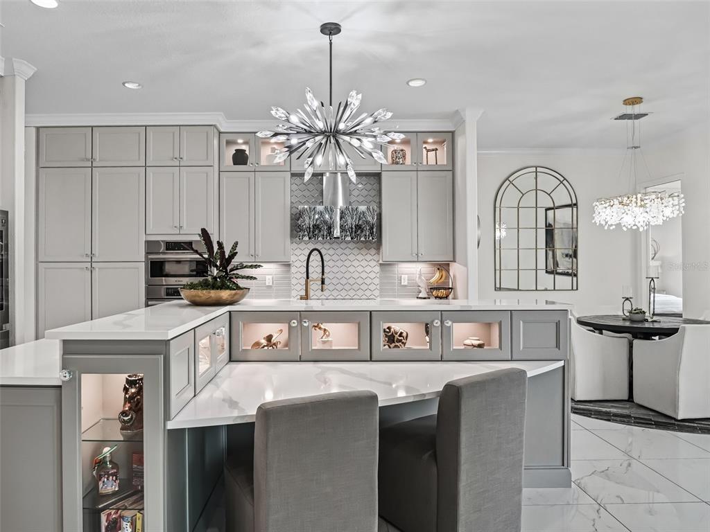 7161 Northeast 22nd Ct Road Ocala, FL 34479 - Photo 40 of 81 a kitchen with stainless steel appliances granite countertop a sink a stove and cabinets
