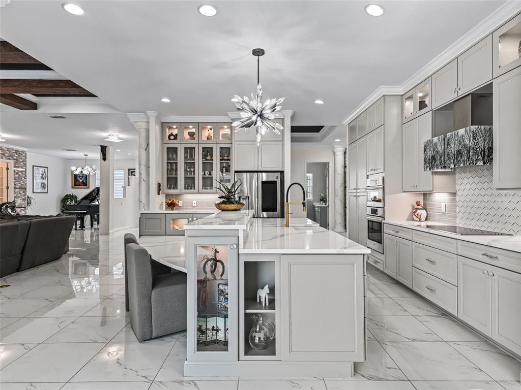 7161 Northeast 22nd Ct Road Ocala, FL 34479 - Photo 42 of 81 a large kitchen with stainless steel appliances a stove sink and cabinets