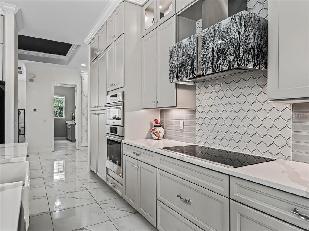 7161 Northeast 22nd Ct Road Ocala, FL 34479 - Photo 44 of 81 a kitchen with stainless steel appliances a sink and cabinets